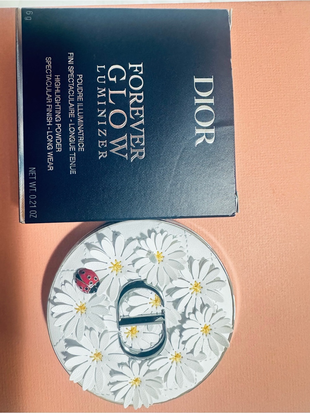 Dior white daisy Floral Compact Illuminizer with Red Ladybug Accent. Last one